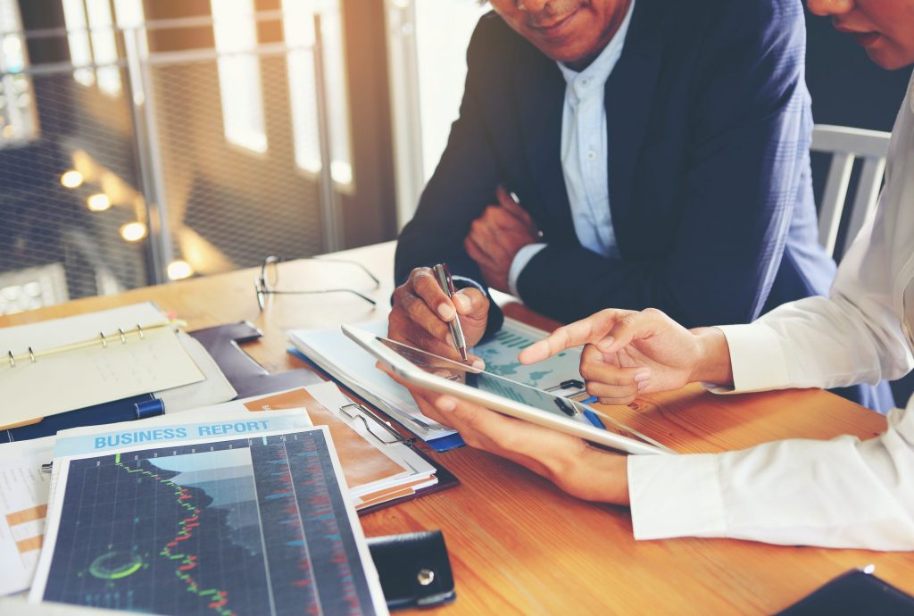 Two businessmen are consulting and planning business operations.